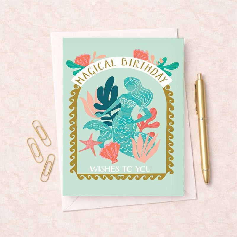 Mermaid-themed birthday greetings card with magical design in soothing blue and green colours. Ideal for fantasy lovers.