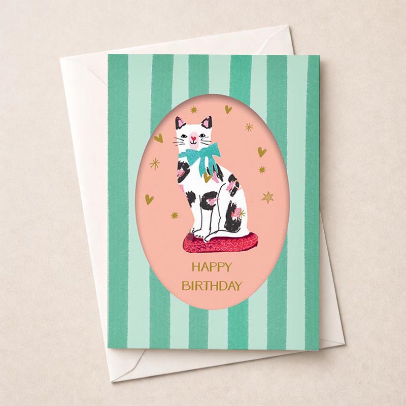 Sweet cat in bow on pink cushion greetings card, perfect for animal lovers or anyone who loves whimsy. Pastel colors exude warmth and coziness.