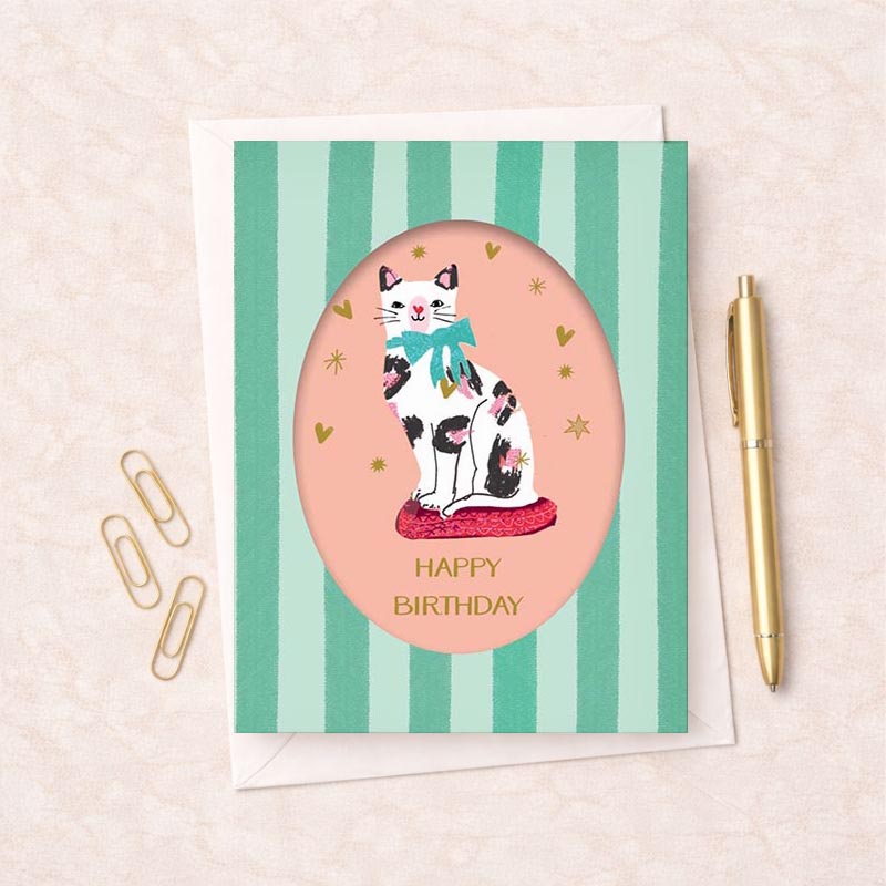Sweet cat in bow on pink cushion greetings card, perfect for animal lovers or anyone who loves whimsy. Pastel colors exude warmth and coziness.