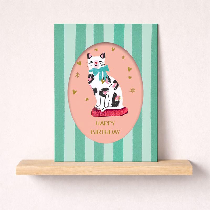 Sweet cat in bow on pink cushion greetings card, perfect for animal lovers or anyone who loves whimsy. Pastel colors exude warmth and coziness.