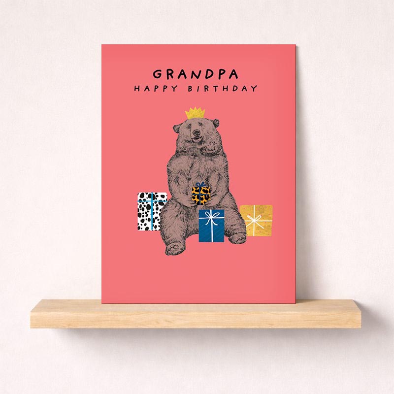 Charming bear card with crown, gift box, and pastel background. Perfect for spreading joy and celebrating special occasions.