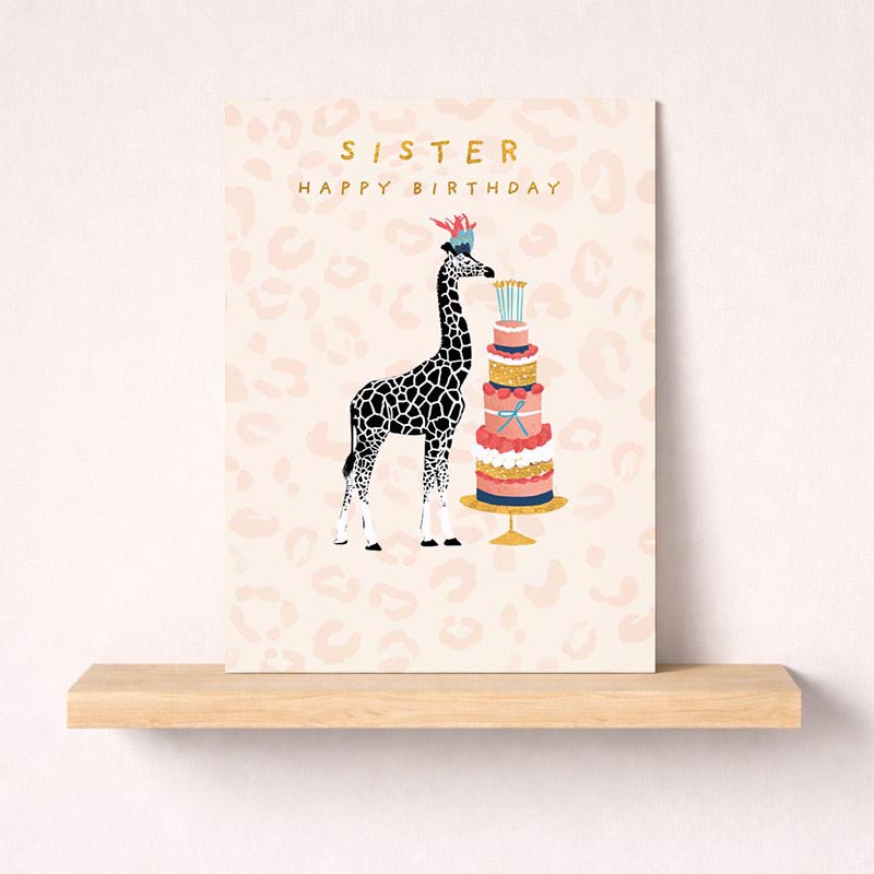 Charming giraffe birthday card with cake, perfect for sisters. Vibrant colours and joyful design to make her day special.