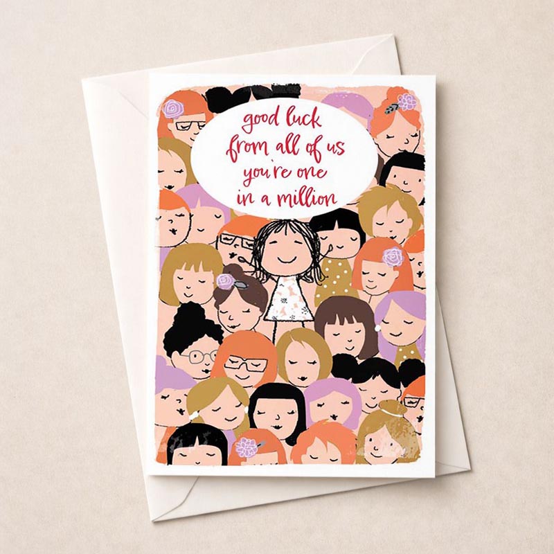 A4 greetings card with girl surrounded by well-wishers, speech bubble says "good luck from all of us in a million.