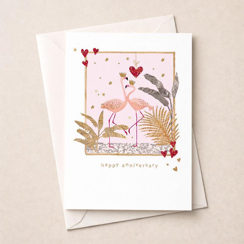 Pink flamingo greetings card with gold frame, heart, and two flamingos with crown. Perfect for celebrating love and special occasions.