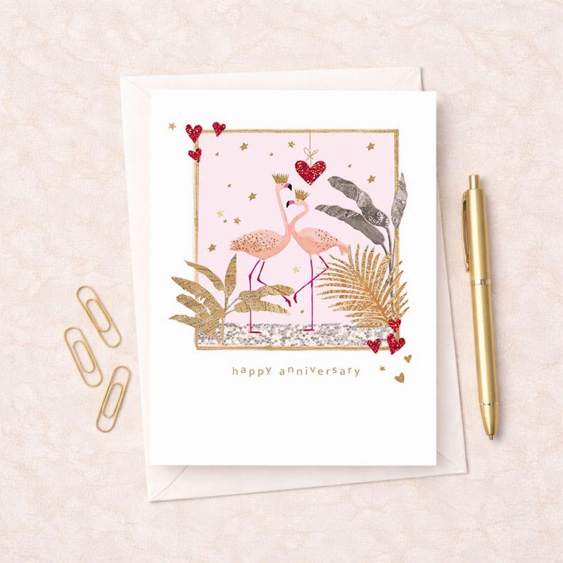 Pink flamingo greetings card with gold frame, heart, and two flamingos with crown. Perfect for celebrating love and special occasions.