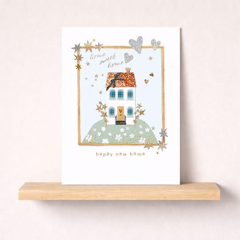Festive greetings card featuring charming house under twinkling stars, perfect for spreading joy and cheer. Ideal for friends, family, or colleagues.