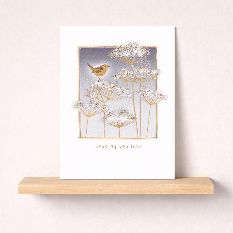 Charming greetings card with bird on flower, perfect for spreading joy to loved ones.
