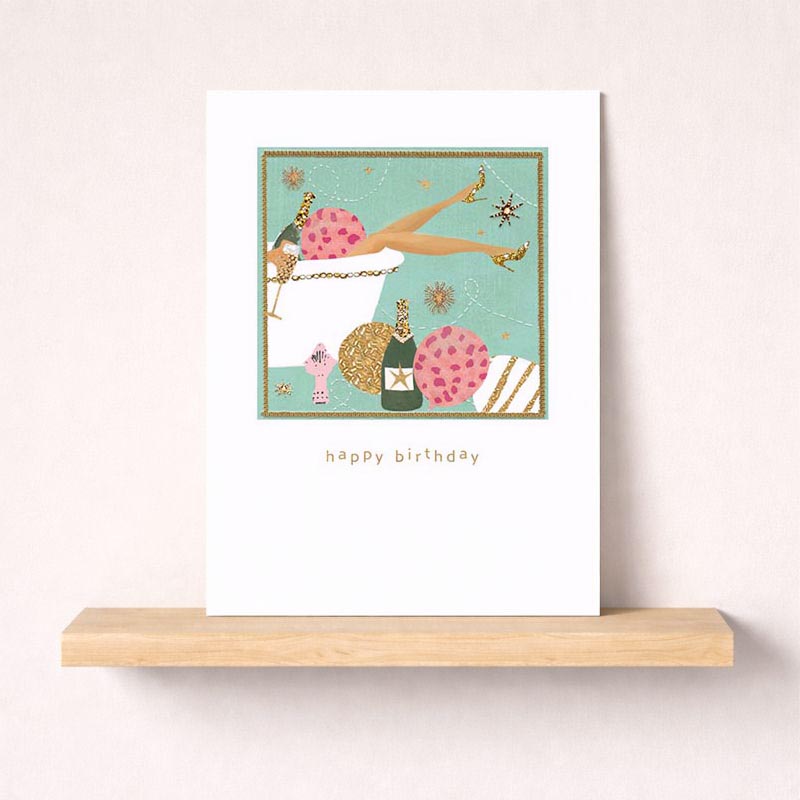 Charming greetings card: woman with cake &amp; champagne, perfect for birthdays or congratulations. Elegant design &amp; soft colours for a touch of sophistication. Ideal for showing you care &amp; making someone feel special. Spread cheer &amp; bring a smile!