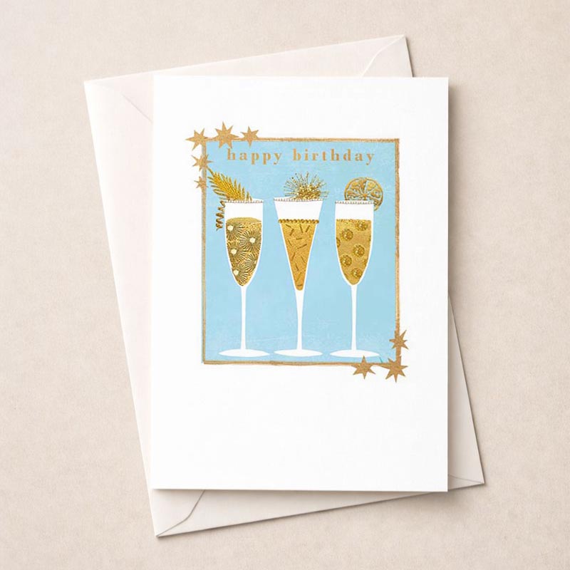 Charming greetings card with champagne glasses and pineapple design, perfect for birthdays or celebrations. Cheers to joy!