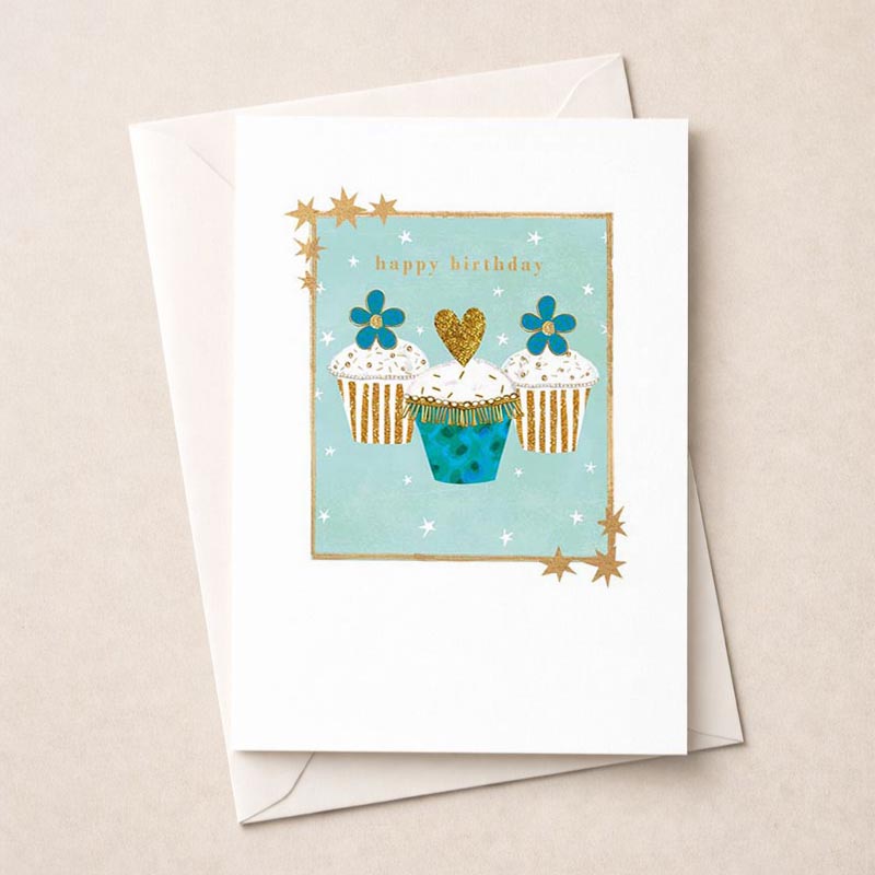 Charming cupcakes card with heart to celebrate special occasions. Gold and blue design adds elegance. Perfect for birthdays, anniversaries, or just to brighten someone's day.