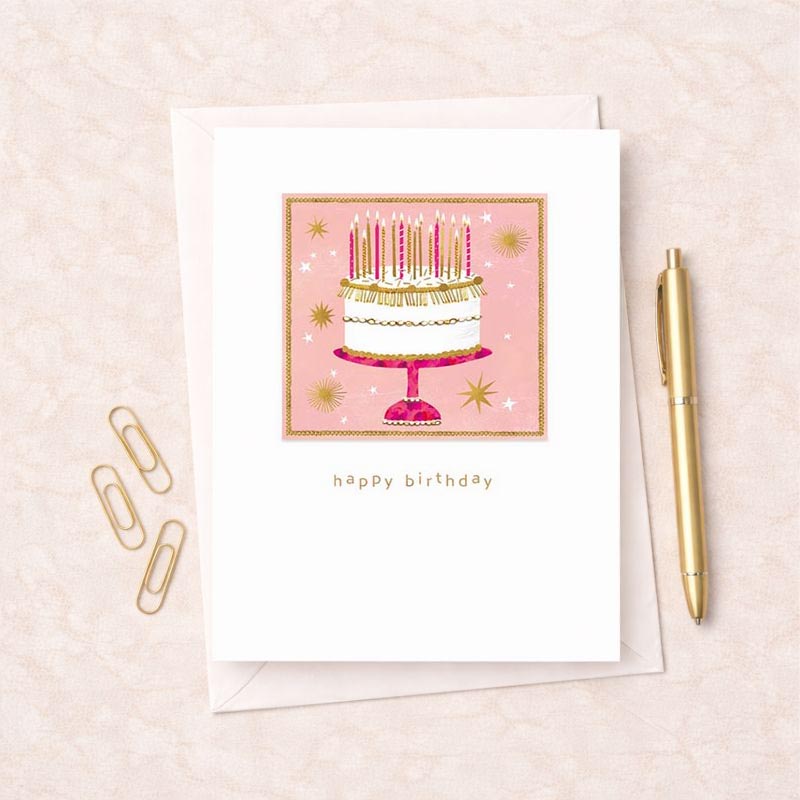 Bright pink greetings card with a cake and candles, perfect for a special birthday celebration.