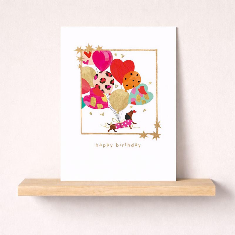 Cheerful dog with balloons card, perfect for birthdays or to brighten someone's day. Ideal for dog lovers or kids.