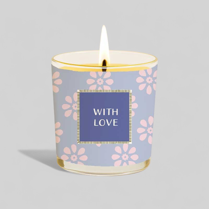 Lit yellow candle in glass with happy birthday and with love gift box.