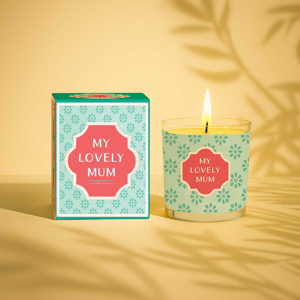 Burning yellow candle with My Lovely Mum label and matching gift box
