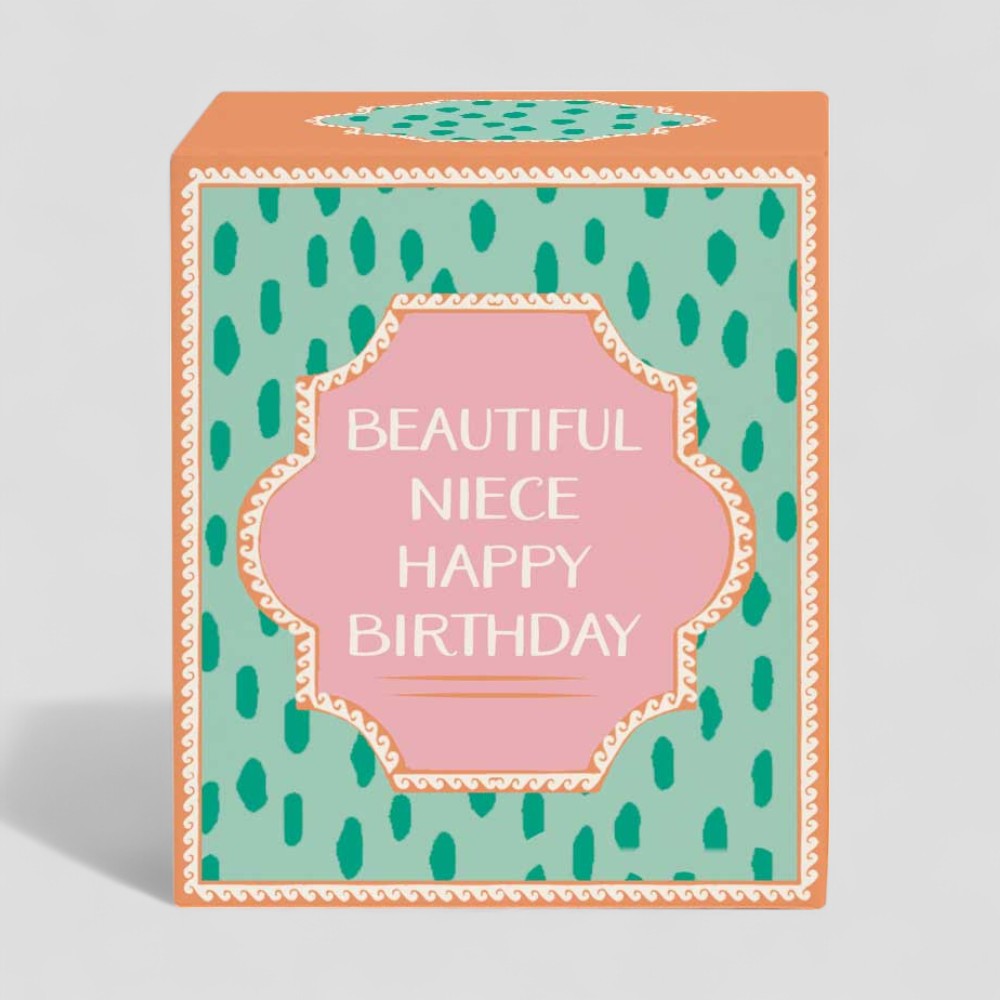 Lit yellow candle and matching box with beautiful niece happy birthday text