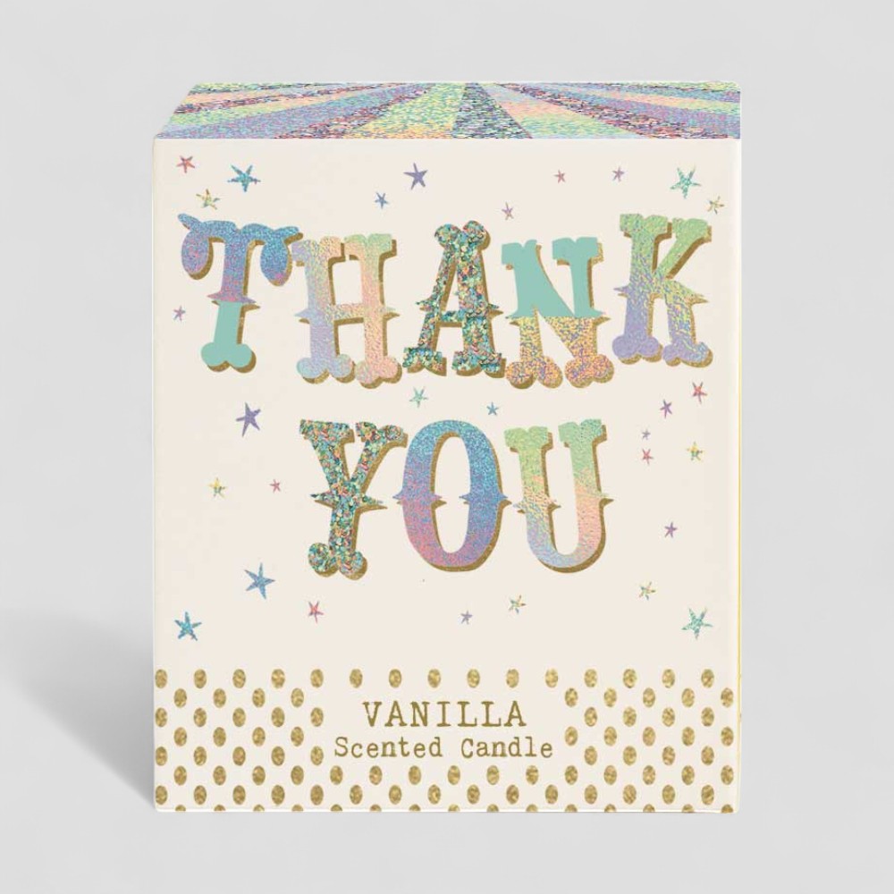 Vanilla scented candle lit with thank you label next to matching thank you box