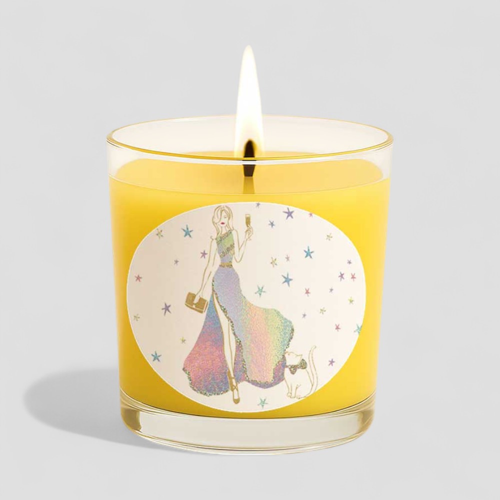 Lit vanilla scented candle with happy birthday packaging and colourful design