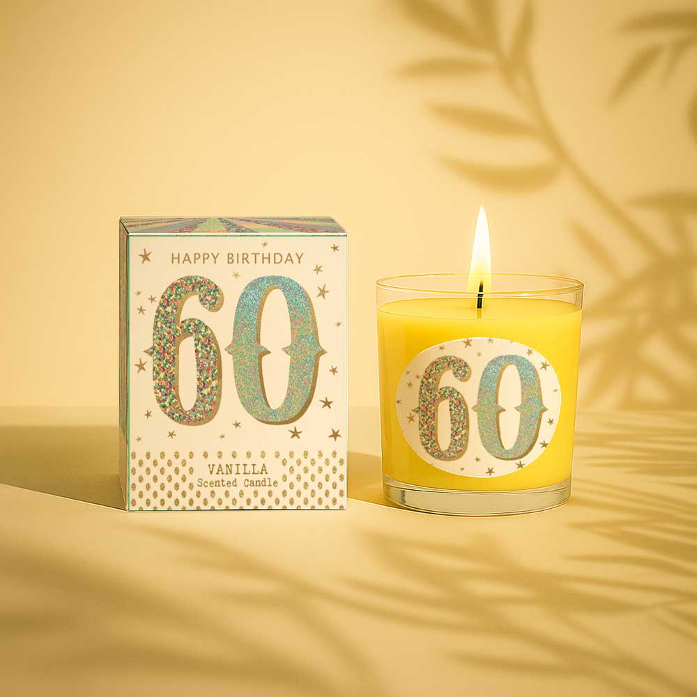 Vanilla scented birthday candle with glittery 60 on box and glass burning