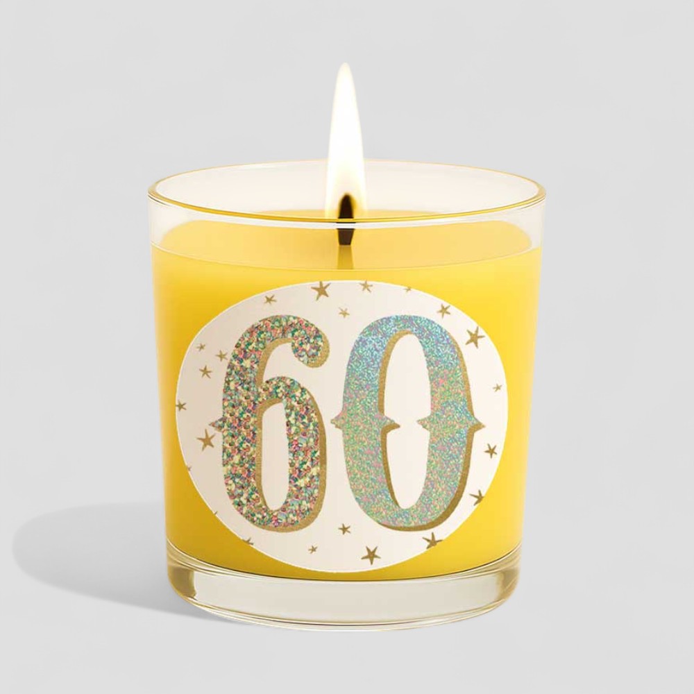 Vanilla scented birthday candle with glittery 60 on box and glass burning