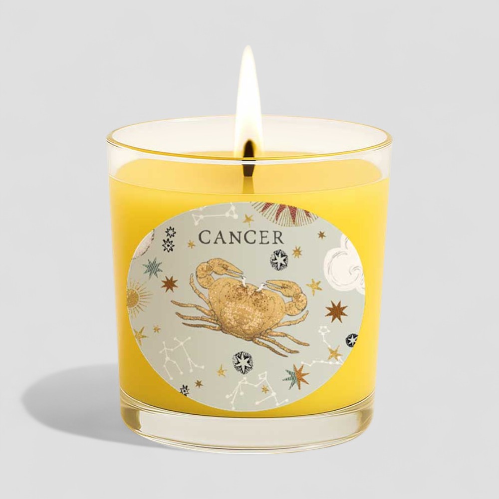 Lit vanilla scented Cancer zodiac candle with matching decorated box