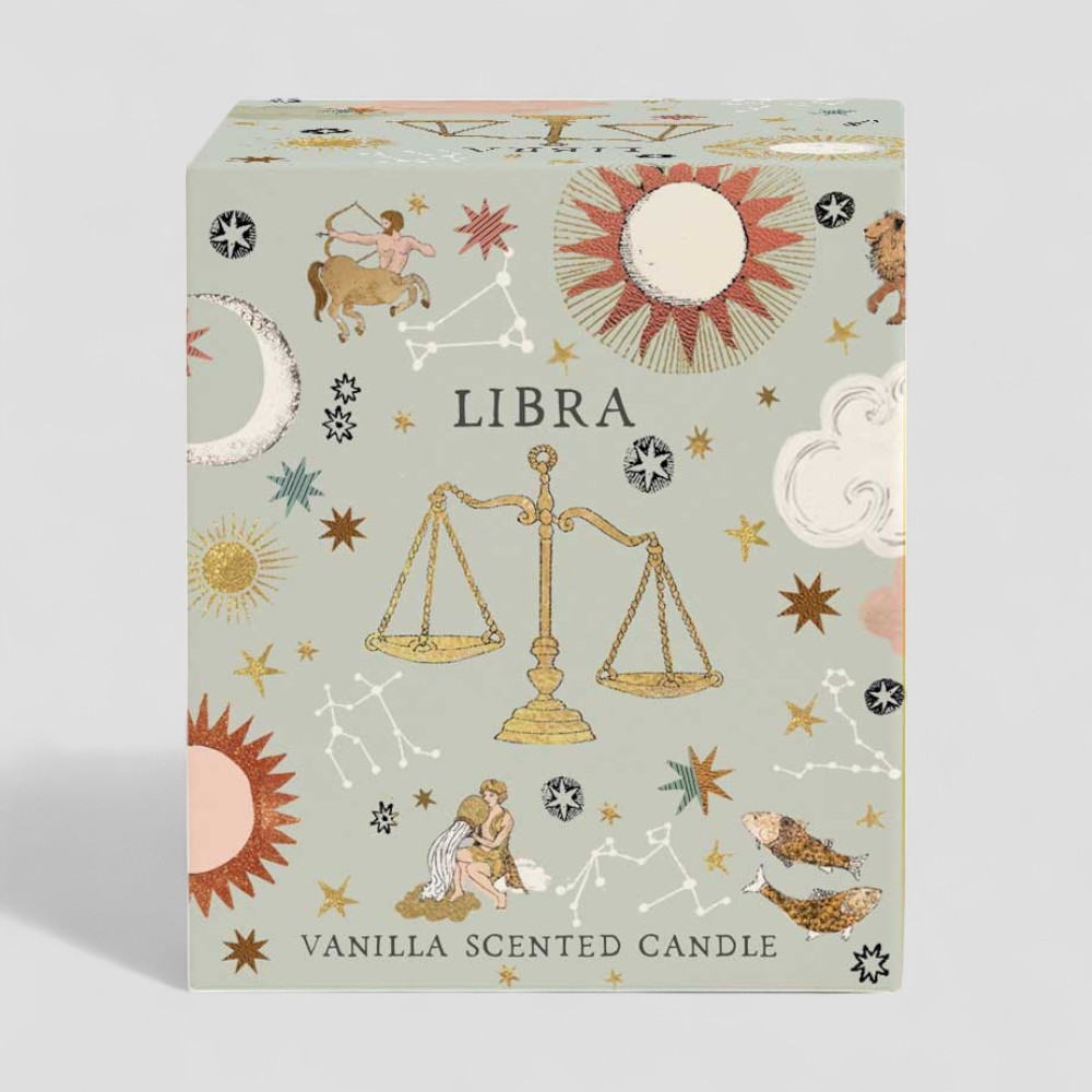 Lit vanilla scented Libra zodiac candle with decorative box and glass holder