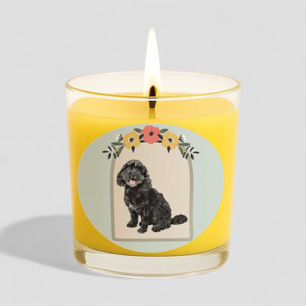 Vanilla scented candle with a black dog illustration on box and glass