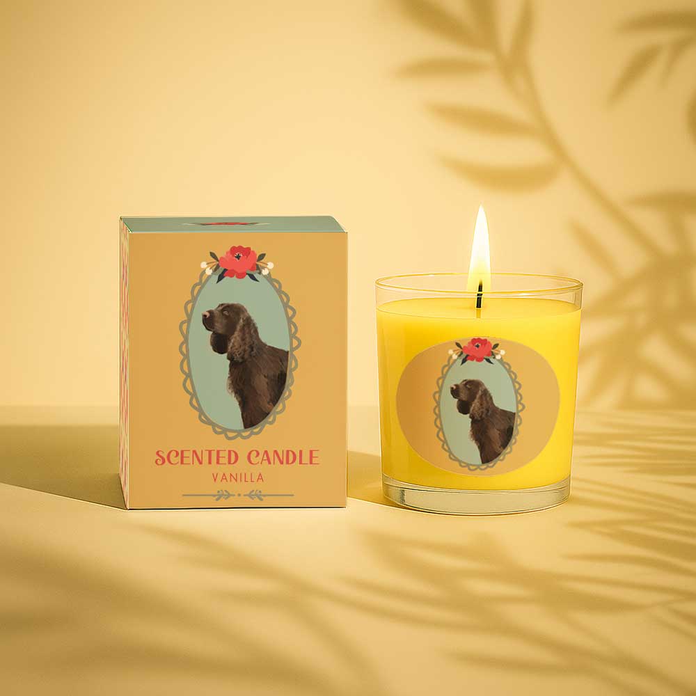 Vanilla scented candle with dog illustration on glass and matching box packaging.