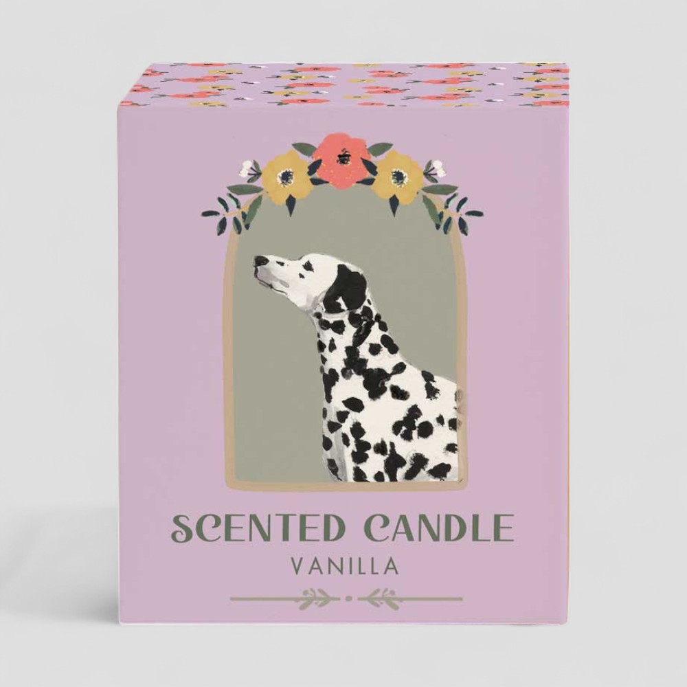 Lit vanilla scented candle with Dalmatian dog design and matching box