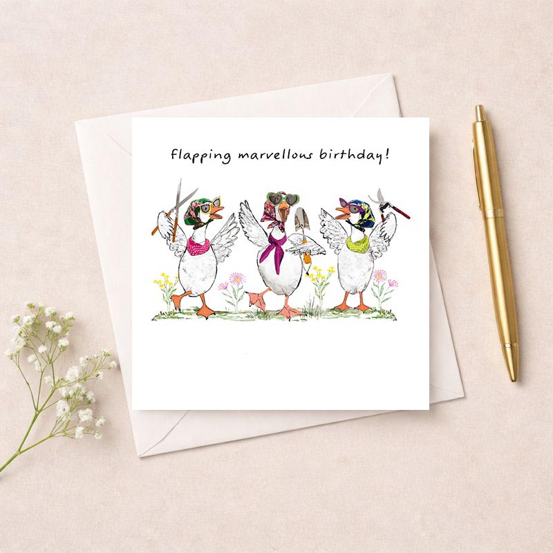 Three ducks in hats and ties on a greetings card, guaranteed to bring a smile. Perfect for spreading joy!