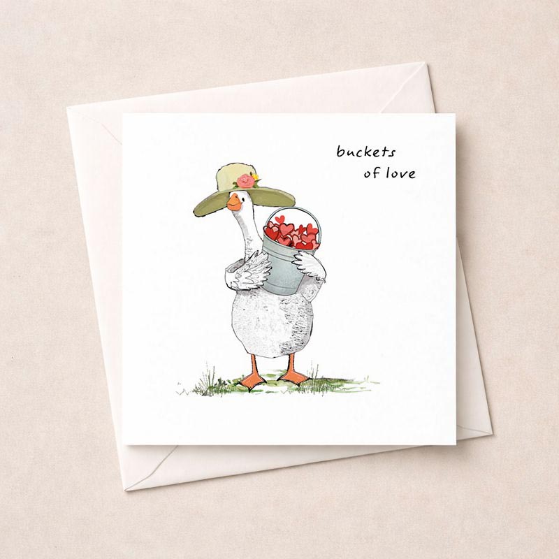 A cute duck with flowers in a bucket on a greetings card, perfect for spreading love and cheer. Ideal for any occasion to bring a smile to someone's face.
