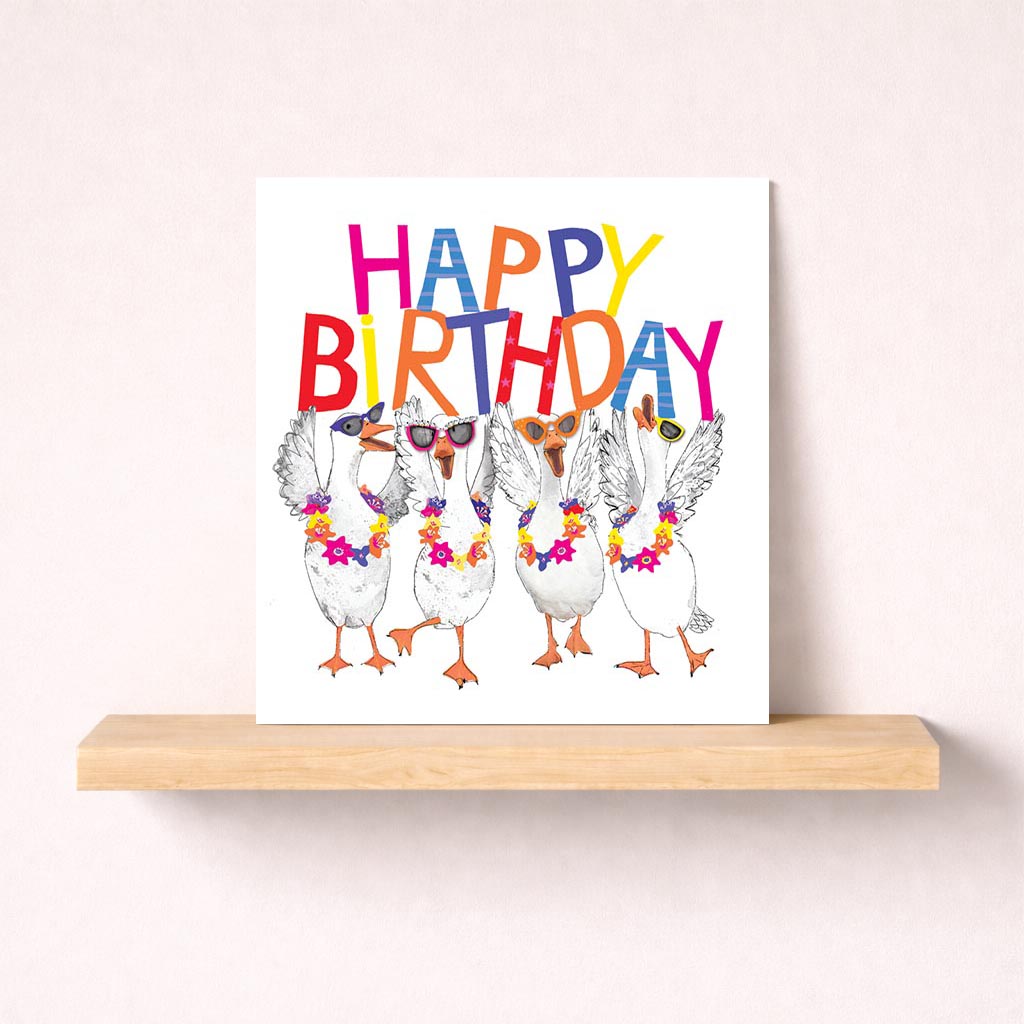 Quirky greetings card with ducks in sunglasses and flower garland, sure to bring a smile. Ideal for birthdays or spreading cheer.