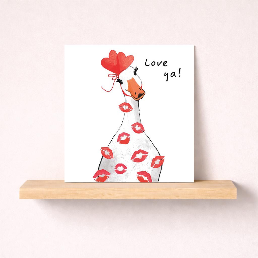 Cheerful duck with lipstick holding heart balloon greetings card - perfect for birthdays or special occasions. Brighten someone's day with this playful design!