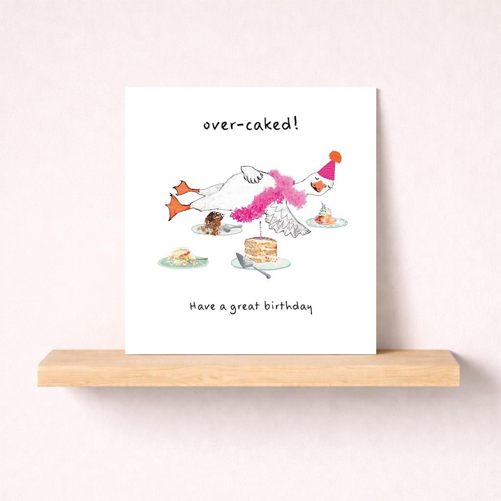 Adorable greetings card with cute chicken in pink hat and scarf, next to a cake with candle. Perfect for birthdays and celebrations.