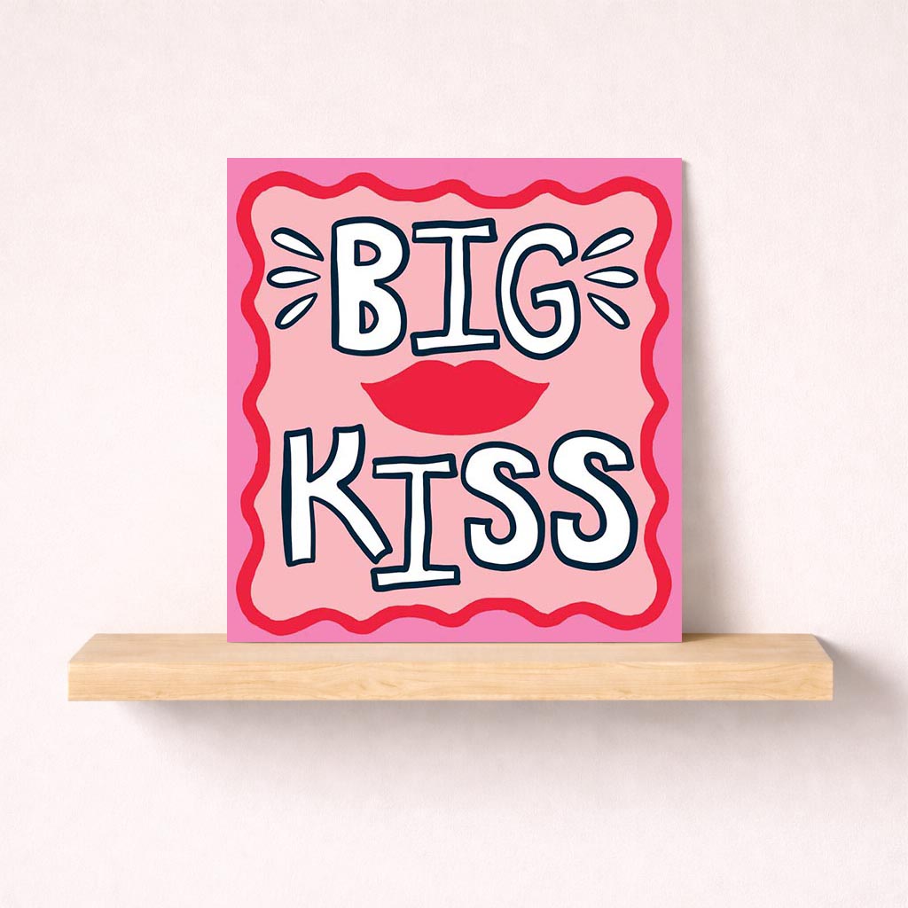 Pink greetings card with big kiss and red lips design, "BIG KISS" displayed. Perfect for expressing love and affection.