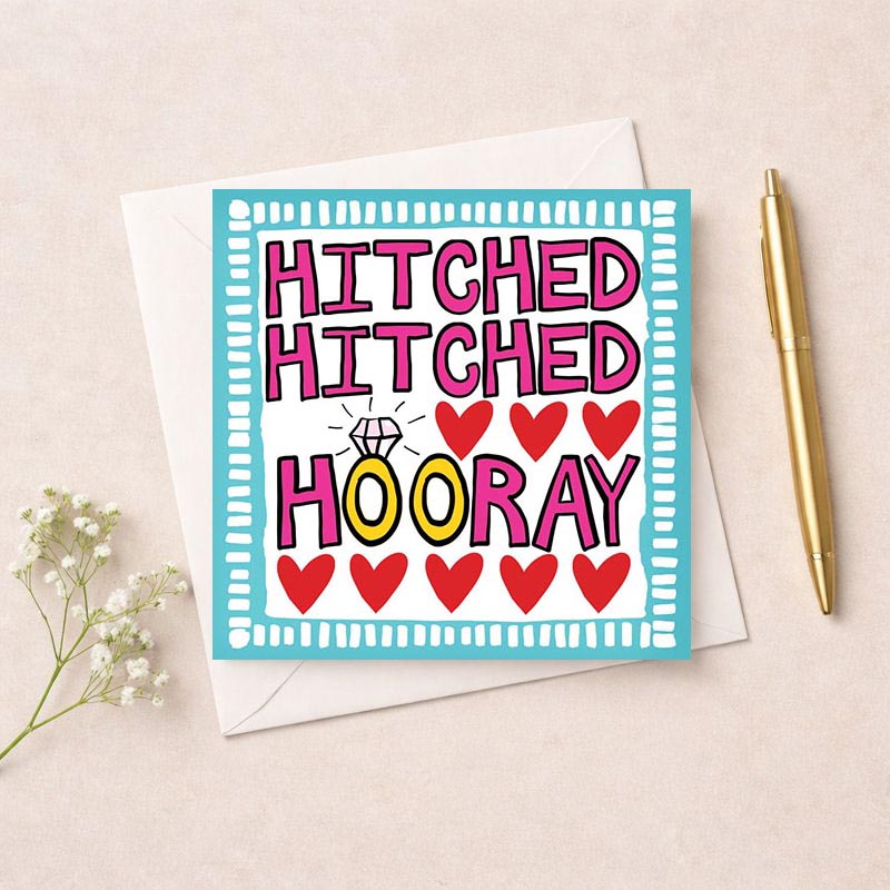 A charming greetings card with "HITCHED HOORAY" message, perfect for celebrating love and weddings. Hand-drawn sign with ring and hearts adds romance.
