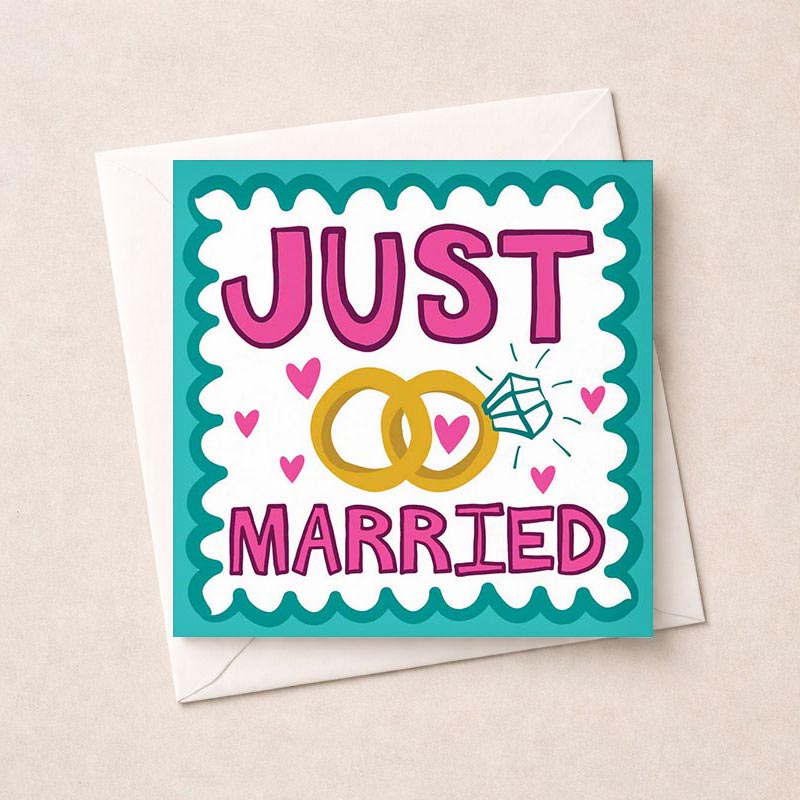 Elegant wedding card with "JUST MARRIED" message, gold rings, and hearts. Perfect for celebrating newlyweds.