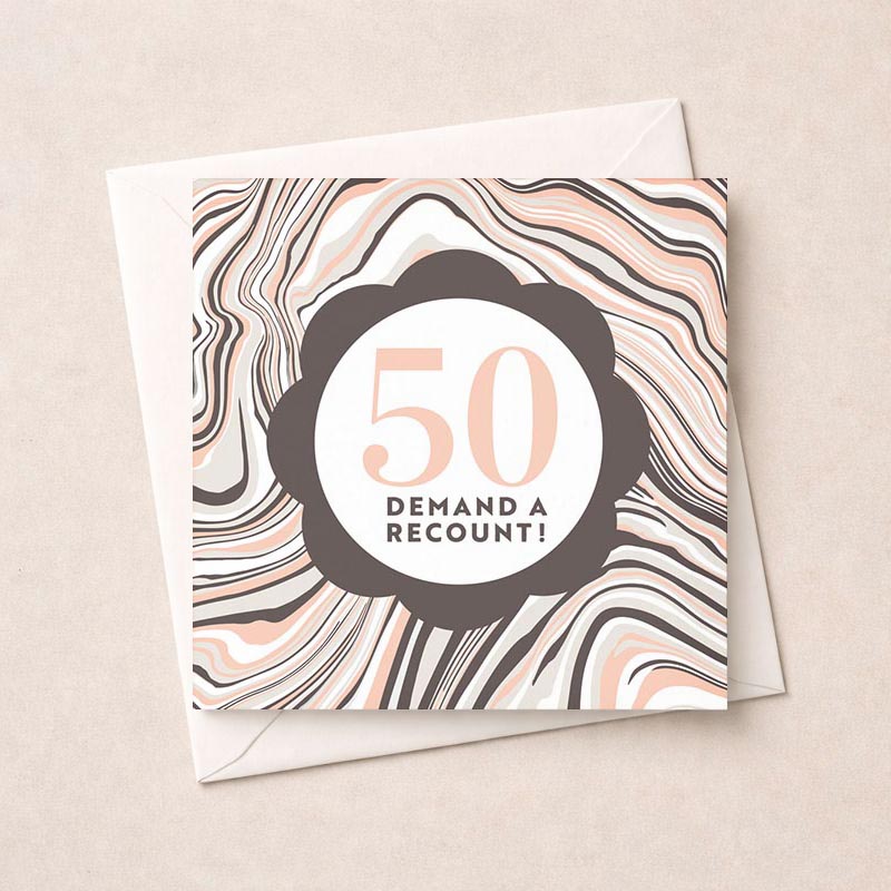 A bold greetings card reads "50 DEMAND A RECOUNT!" on a marble background. Perfect for a light-hearted message.