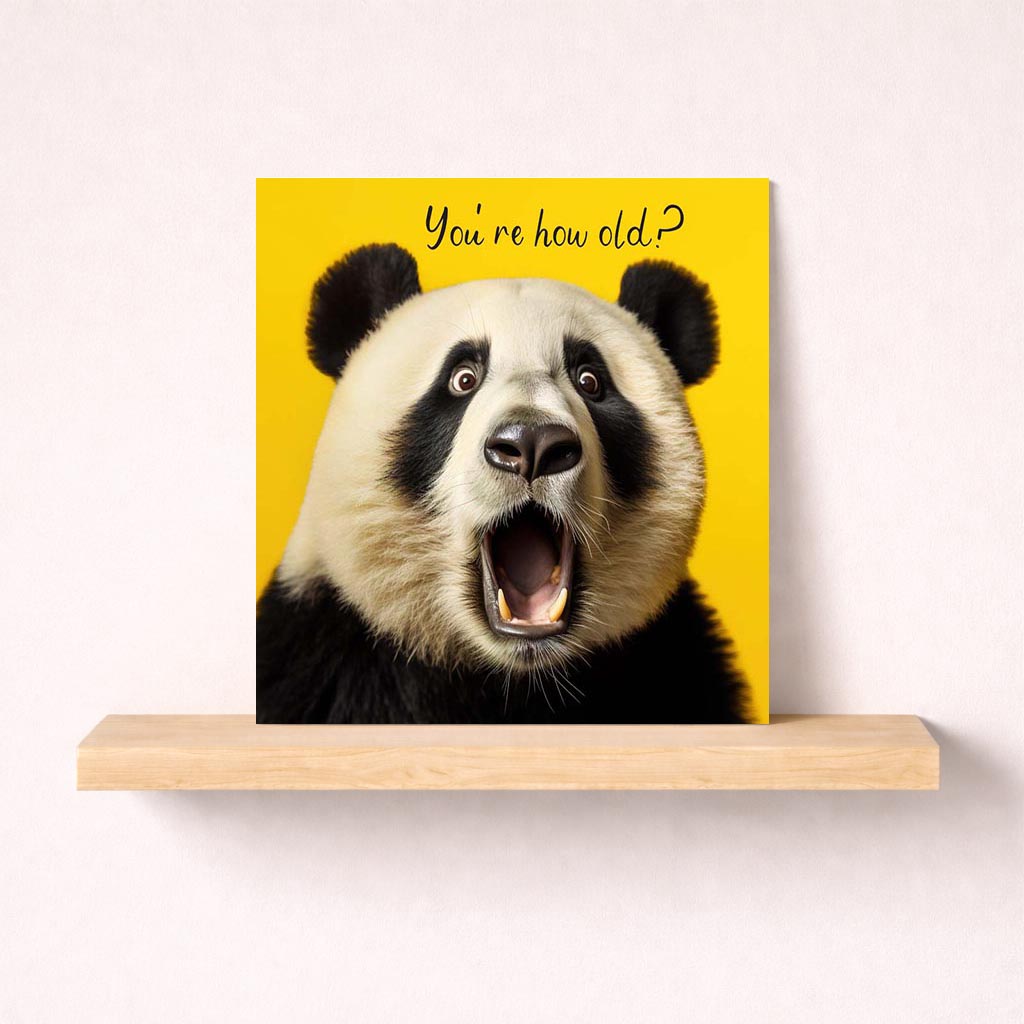 Cheerful greetings card with playful panda on yellow background. Perfect for birthdays or spreading joy and laughter.