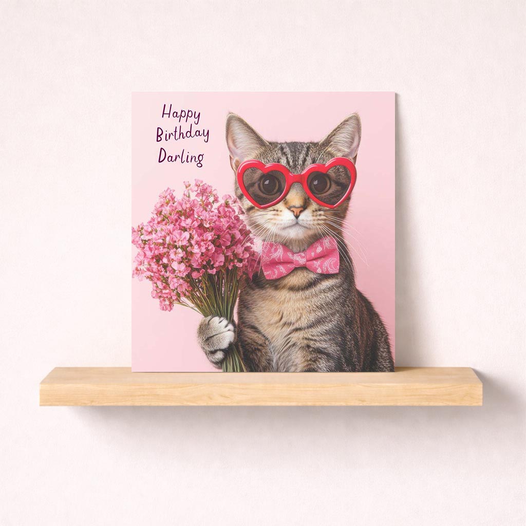 Cheerful cat in heart glasses with flowers on cute greetings card. Brighten someone's day!