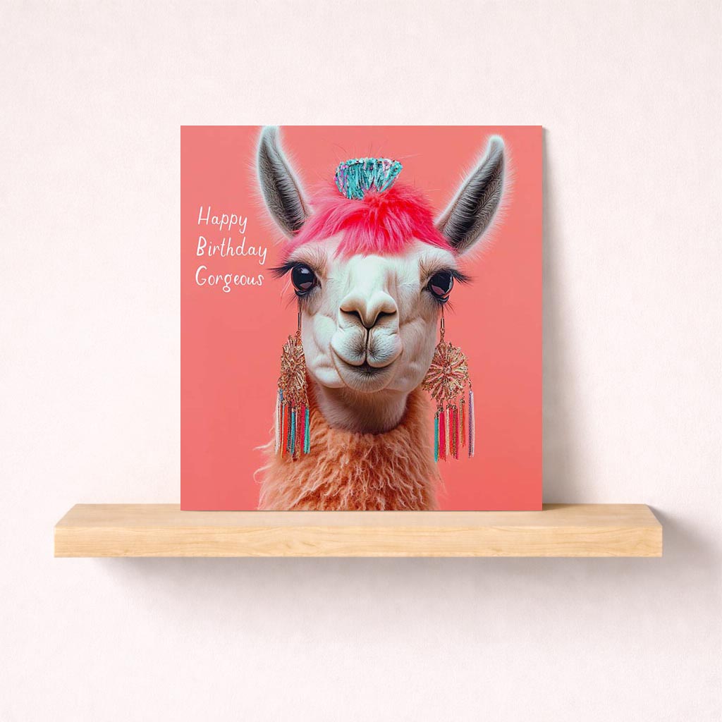 Quirky llama greetings card with funky pink mohawk brings fun and cheer. Perfect for spreading joy to friends and family.