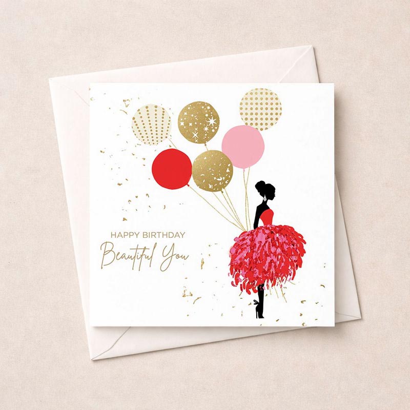 Vibrant greetings card with woman in red dress holding balloons, perfect for birthdays or special occasions. Spread joy and cheer!