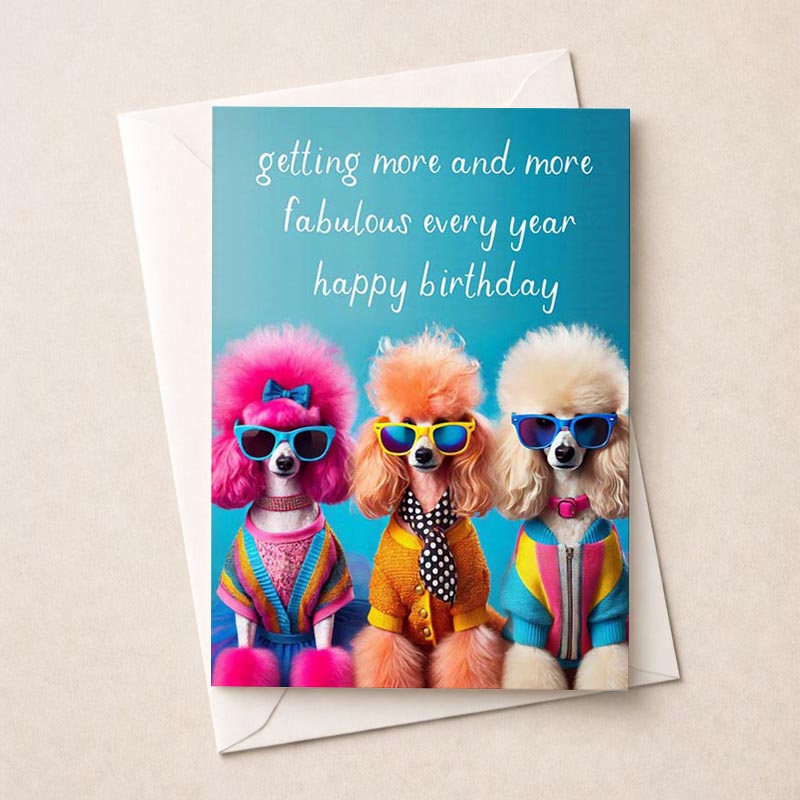 Three poodle dogs in sunglasses and a sweater on a greetings card. Perfect for dog lovers and those needing a smile!
