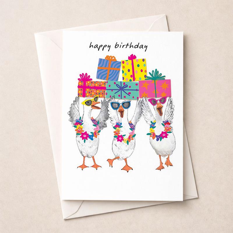 Cheerful greetings card with three ducks wearing presents on their heads. Perfect for spreading joy and laughter on any occasion!