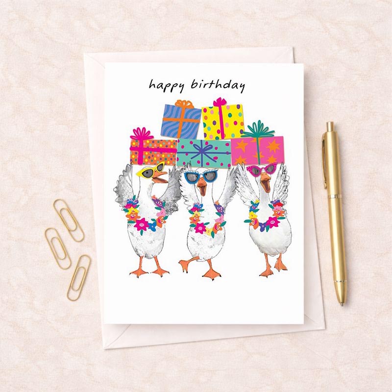 Cheerful greetings card with three ducks wearing presents on their heads. Perfect for spreading joy and laughter on any occasion!