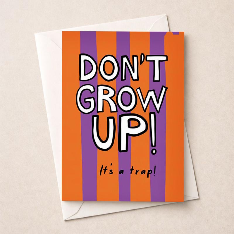Colorful striped greetings card with "don't grow up" sign - perfect for adding a playful touch to any occasion.