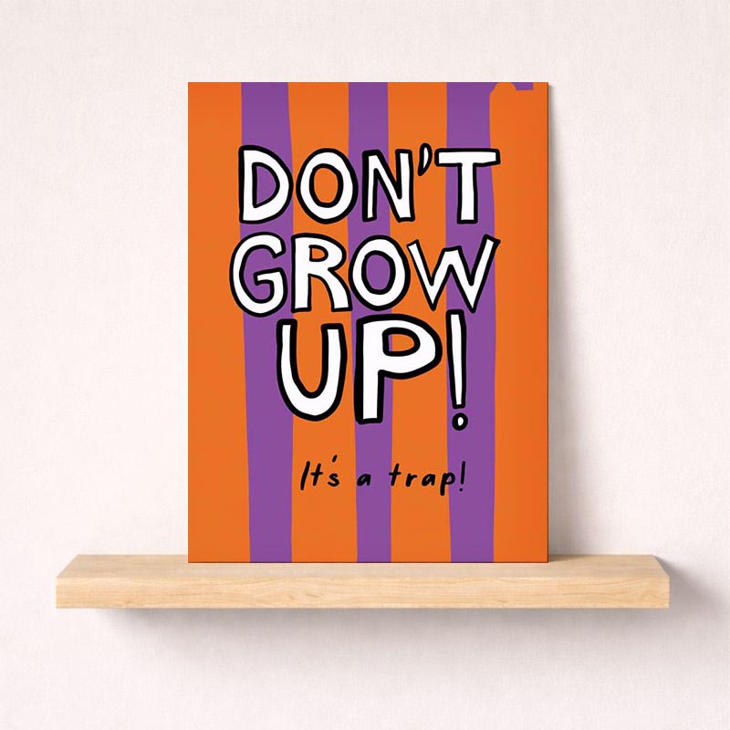 Colorful striped greetings card with "don't grow up" sign - perfect for adding a playful touch to any occasion.