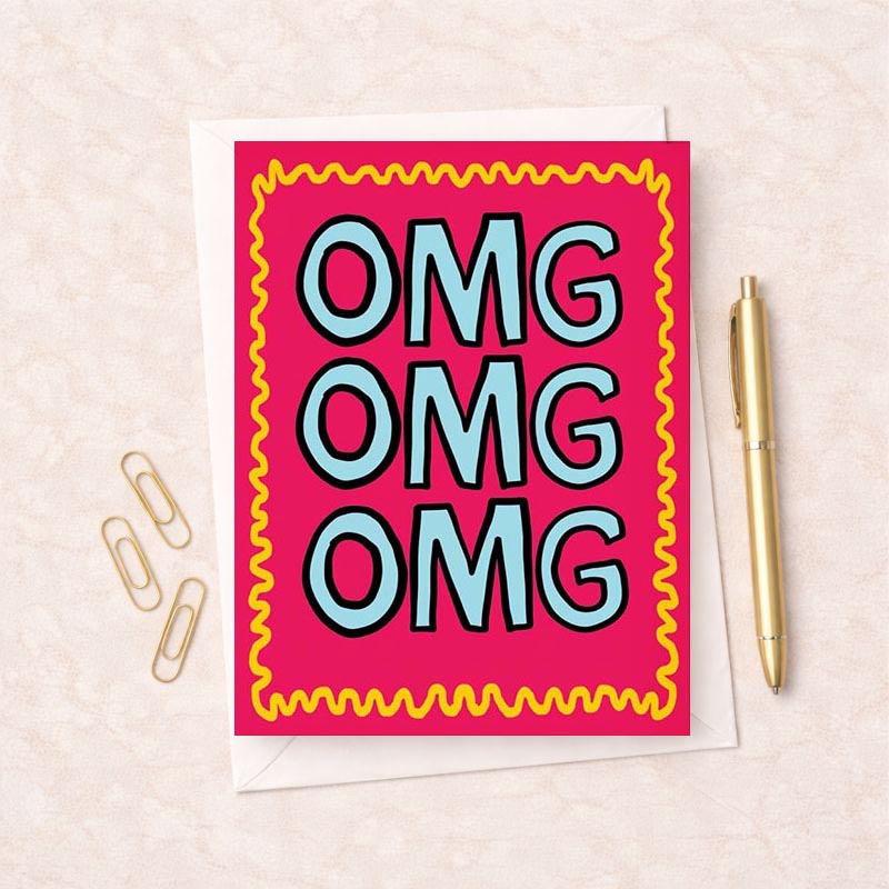 Bright pink and yellow greetings card with omg design in blue and pink, perfect for spreading joy and cheer.