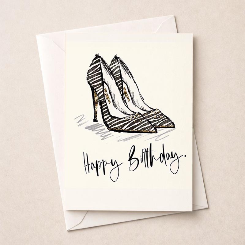 Stylish zebra print high heel shoe greetings card with gold trim, perfect for fashion-forward birthday wishes.