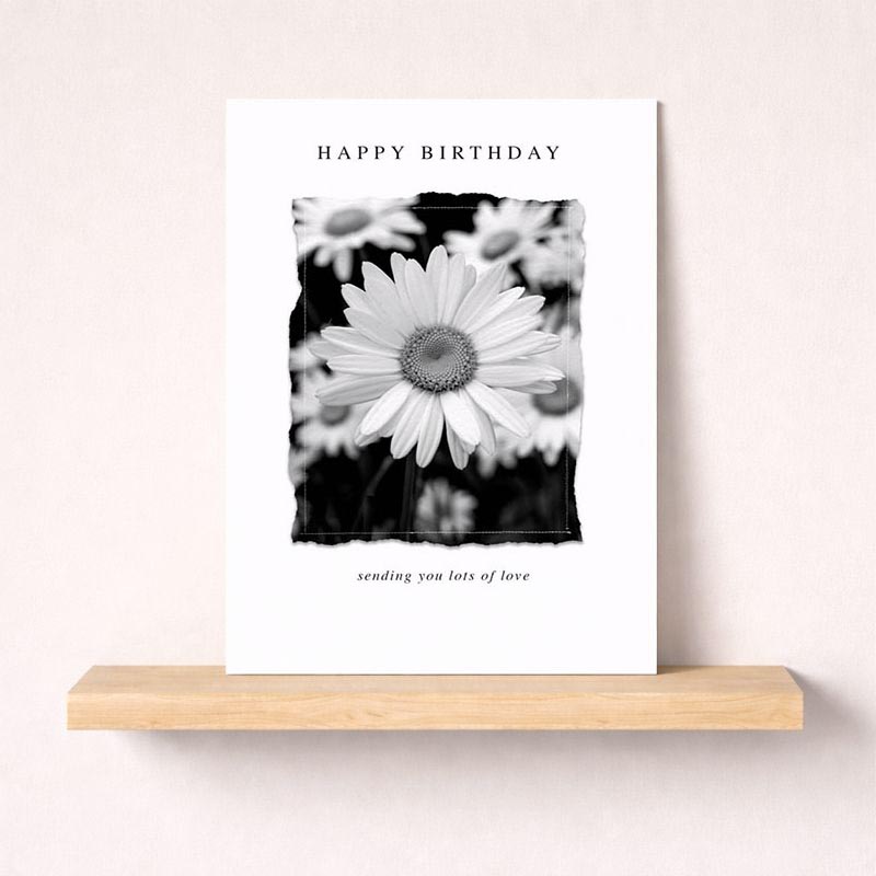 Classic black and white floral greetings card with "Happy Birthday" text. Perfect for heartfelt messages.