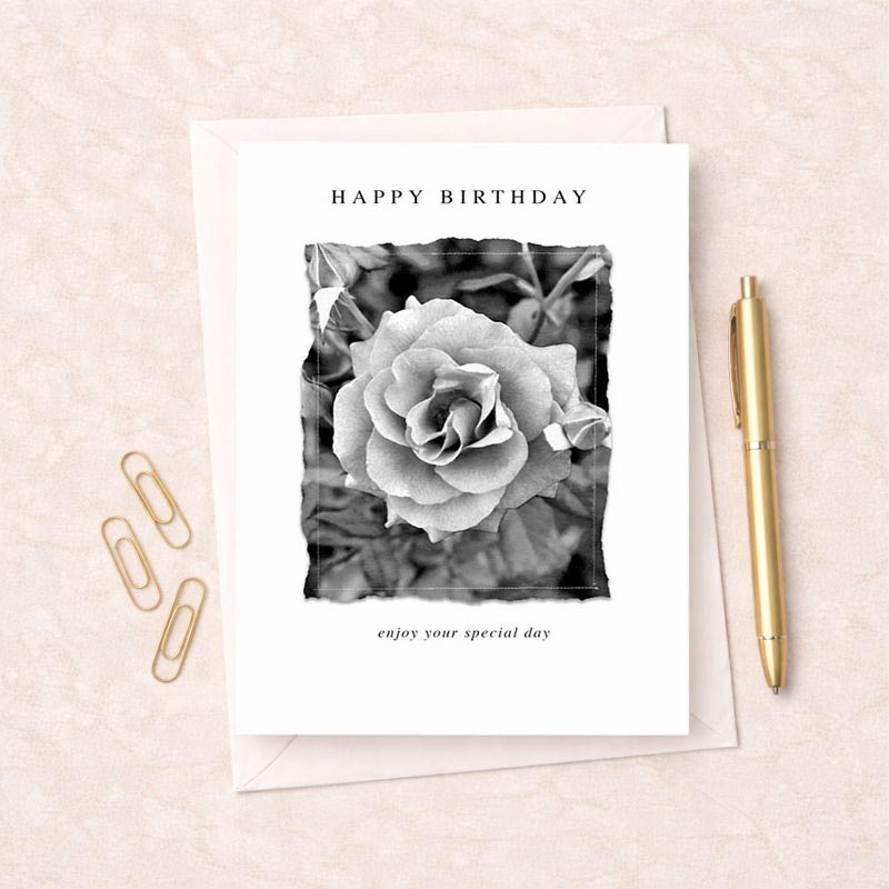 Elegant black and white birthday card with rose and "happy birthday" wishes. Perfect for any special occasion.